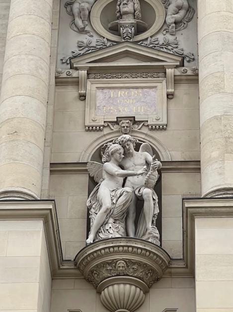 A statue on a building

Description automatically generated