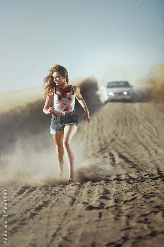 Bloody female being chased by a car Stock Photo | Adobe Stock