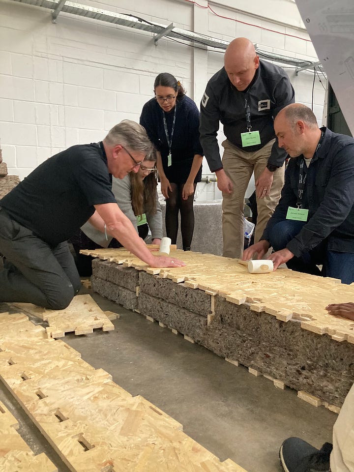 Images showing the BE-ST Fest conference attendees and a series of images of a WikiHouse build. People can be seen building and insulating WikiHouse blocks and connecting them together.