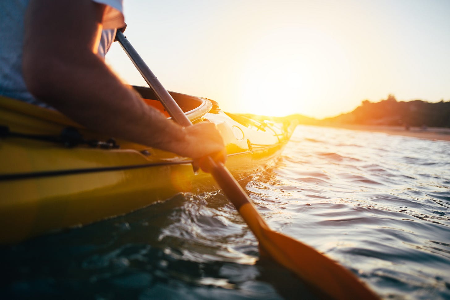 A young man canoeing.