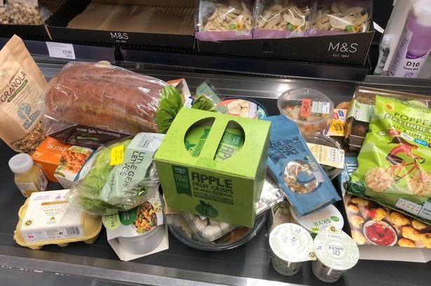 This may contain: an assortment of food items on display in a grocery store