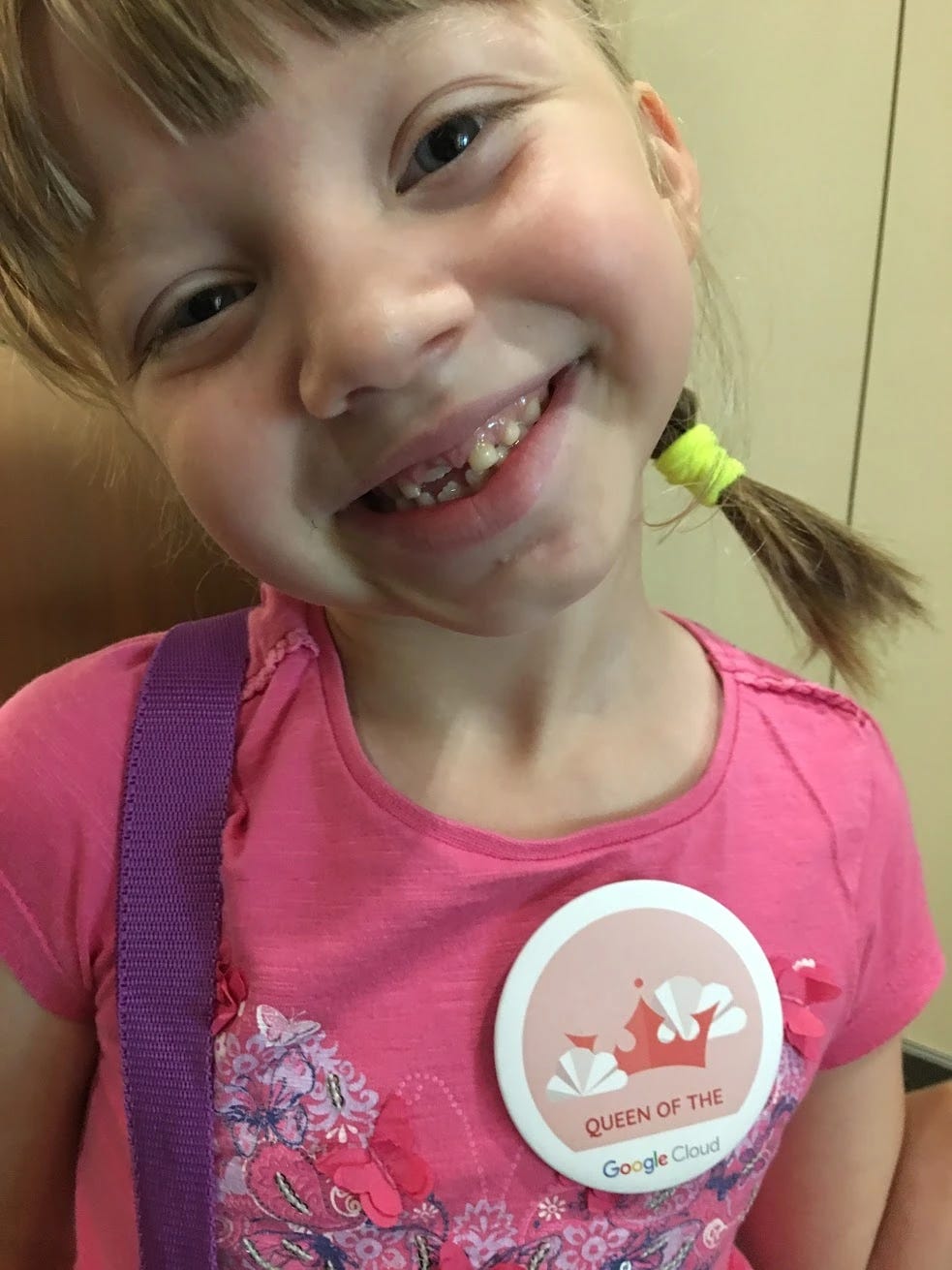 My daughter smiling with a Google Cloud badge My daughter smiling with a Google Cloud badge