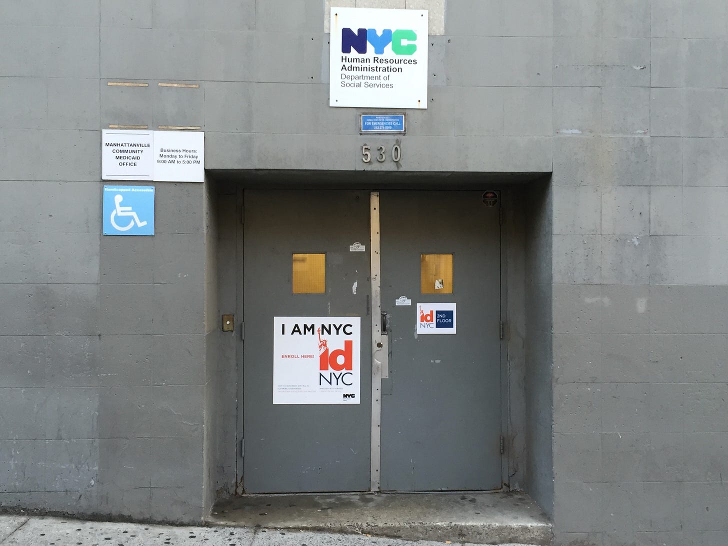 a photo of an intimidating door to a Medicaid office in New York City