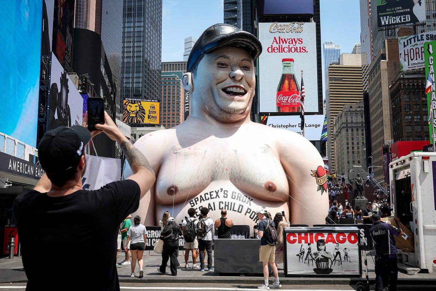 May be an image of crowd, Times Square and text that says 'Always delicious. FOREVEL WICKED 로게임 LITTLES HORF C เร កបត A KNG Coca-Coli 오어로내리] r AMERICAN EAG rhristopherCLange Lange Christopher SPACEX'S GAI CHILD POR GROK GRO/ IdNudles CHICAGO'