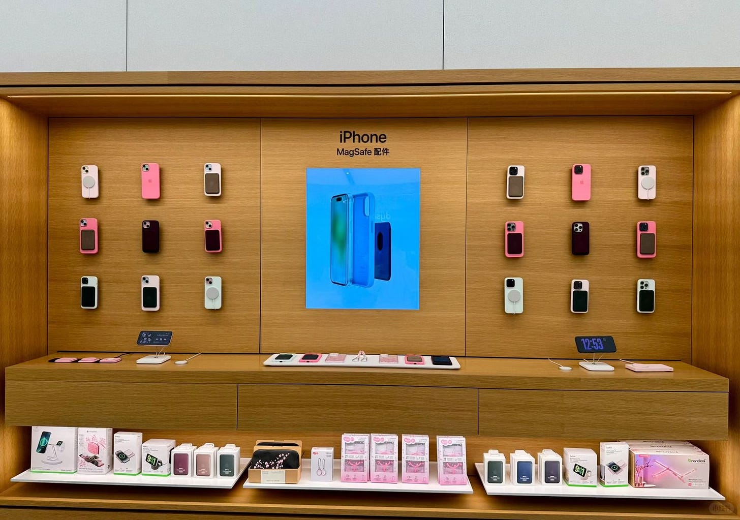 An iPhone MagSafe accessory bay merchandised with pink cherry blossom accessories. An iPhone MagSafe accessory bay merchandised with pink cherry blossom accessories.