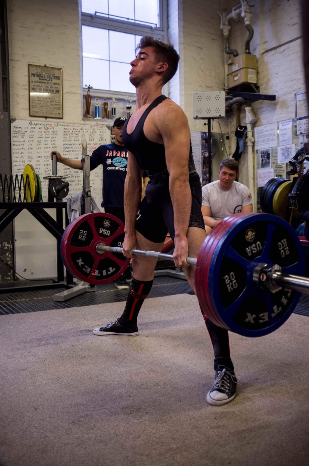 Alex deadlifting 210kg in a powerlifting competition