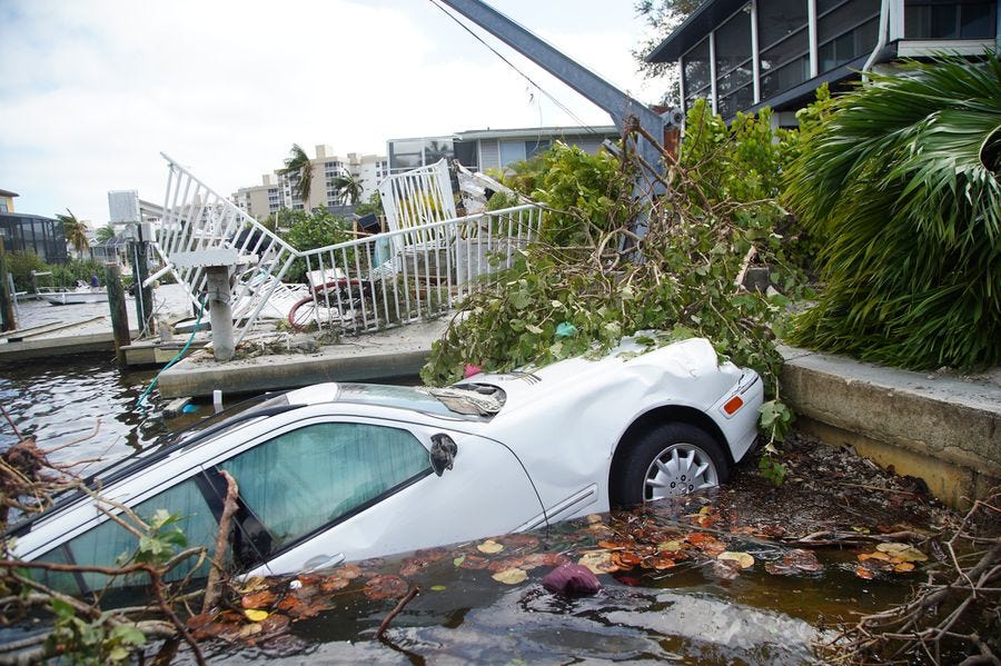 Vehicles thrown into a canal by Hurricane Ian are seen on Thursday, Sept. 29, 2022 in Bonita Beach. Vehicles thrown into a canal by Hurricane Ian are seen on Thursday, Sept. 29, 2022 in Bonita Beach.