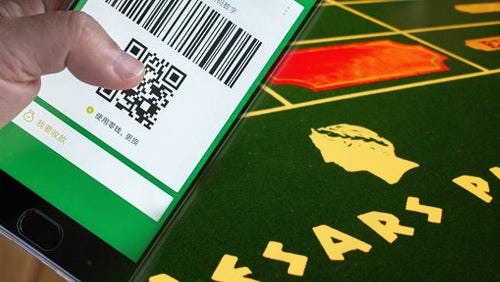 Caesars punts on WeChat Pay to win over Chinese gamblers in Las Vegas Caesars punts on WeChat Pay to win over Chinese gamblers in Las Vegas