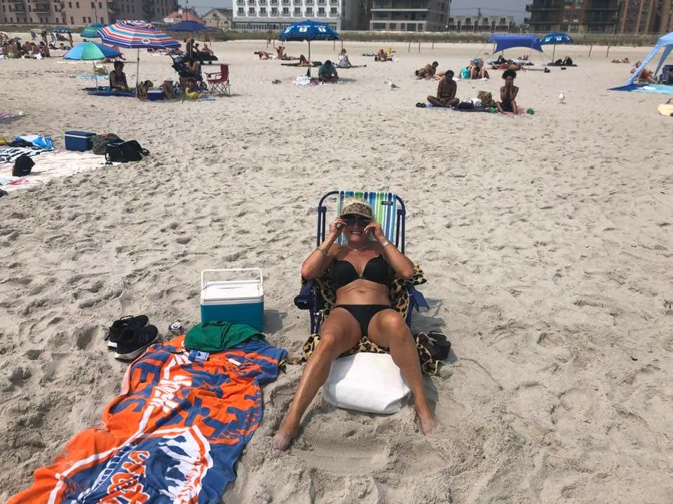 May be an image of 3 people and beach