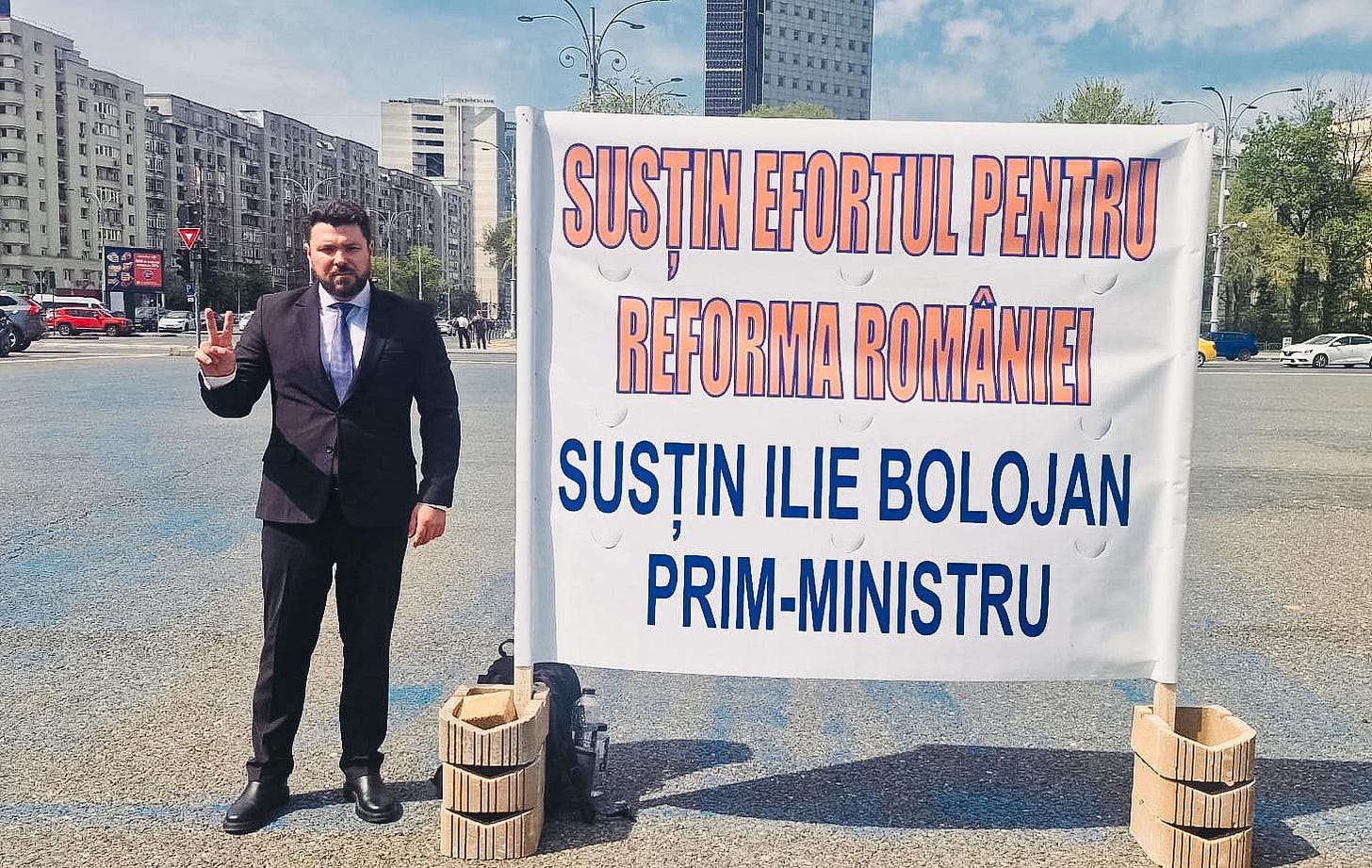 May be an image of text that says "SUSȚIN EFORTUL PENTRU REFORMA ROMANIEI SUSȚIN ILIE BOLOJAN PRIM PRIM-MINISTRU"