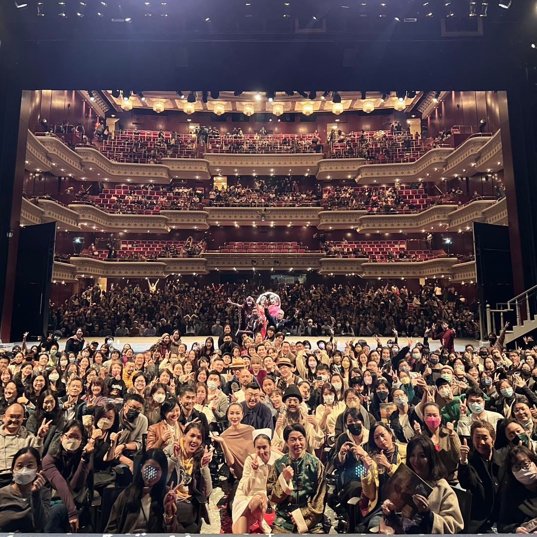 The cast and crew pose with audience members for a photo at the closing night of Stan Lai's "A Dream Like a Dream" in Taipei