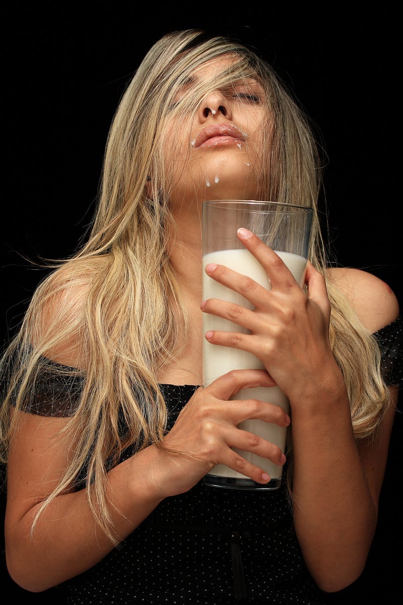 An seductive woman escaping with milk. An seductive woman escaping with milk.