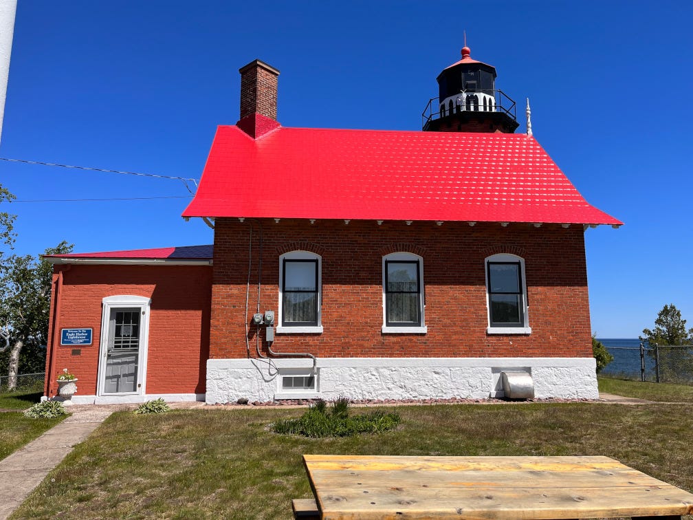 Picture of a red roofed lighthouse from Eagle harbor Michigan
