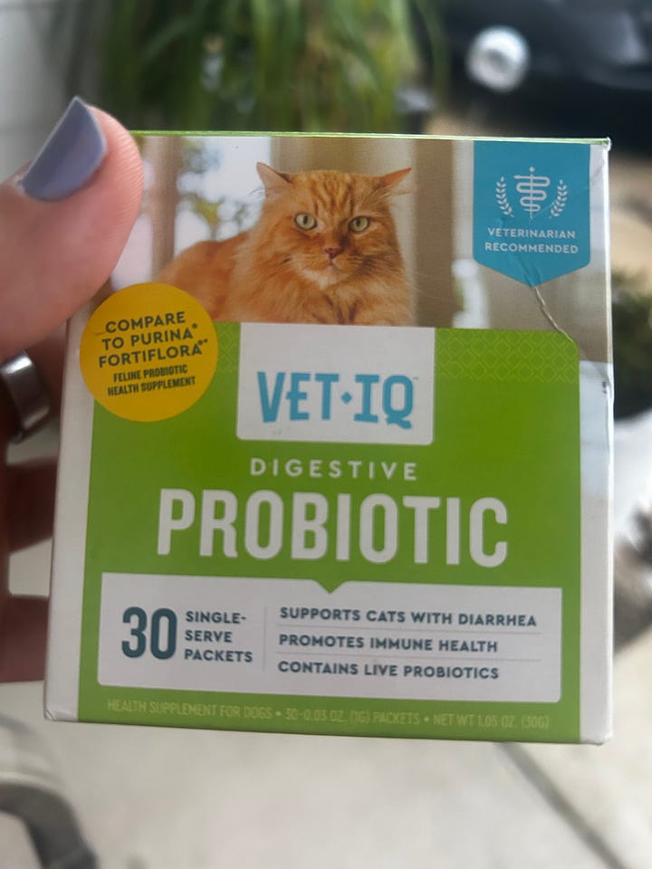 Photo gallery showing the supplements and therapies used during Mookie's recovery, including feline colostrum, probiotics, vitamin C, and a Sonic Slider weighted tuning fork for sound therapy.