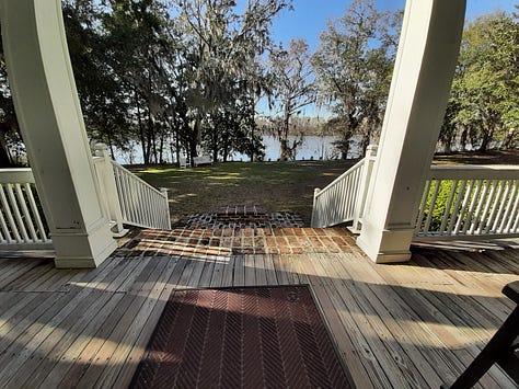 Three photos showing the outside of Hopsewee Plantation, a two story white house with a balcony running the length of the second floor. One of the pictures is taken from the porch and shows trees and the North Santee River.
