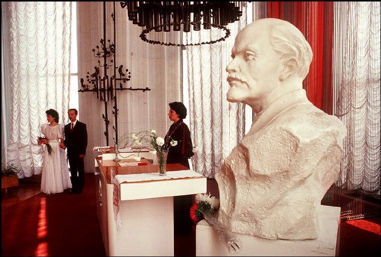 A joyous wedding ceremony at Kyiv's City Hall, capturing a moment of personal celebration amidst the era's complexities. A joyous wedding ceremony at Kyiv's City Hall, capturing a moment of personal celebration amidst the era's complexities.