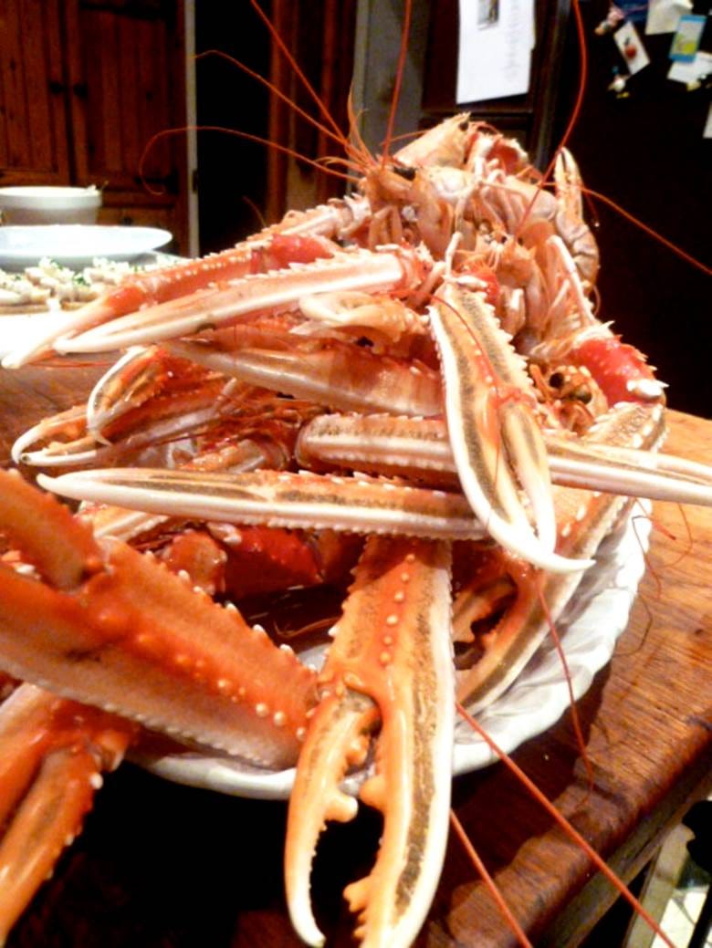 A pile of lobster claws on a plate

Description automatically generated