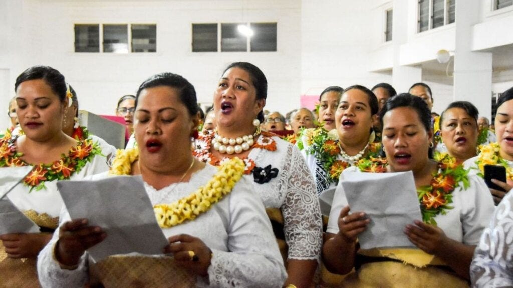 The Tongan people are singing hymns in the church