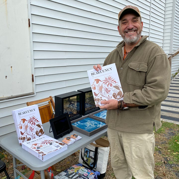 Photos of the author and a community member at CREATE Council on the Arts open house event.