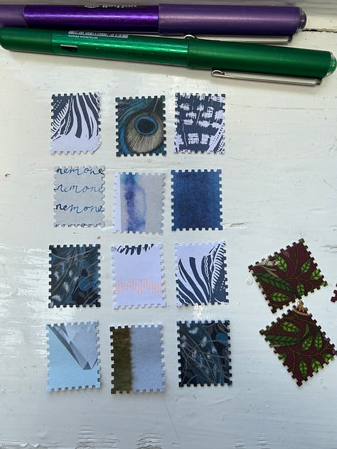 Open sketchbook, paper and magazine images, a hole punch and a glue stick