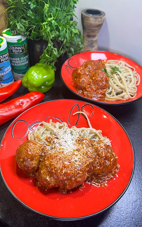 Photo 1: Overhead side shot of jerk chicken meatballs in a rich tomato sauce Photo 2: Tomato sauce cooking in a pan with teaspoonfuls of seasoning powder Photo 3: Two bowls of linguine pasta with the meatballs and tomato sauce with a small coating of grated parmesan cheese
