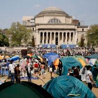 Student protesters gather inside their encampment on the Columbia University campus in New York on April 29, 2024.