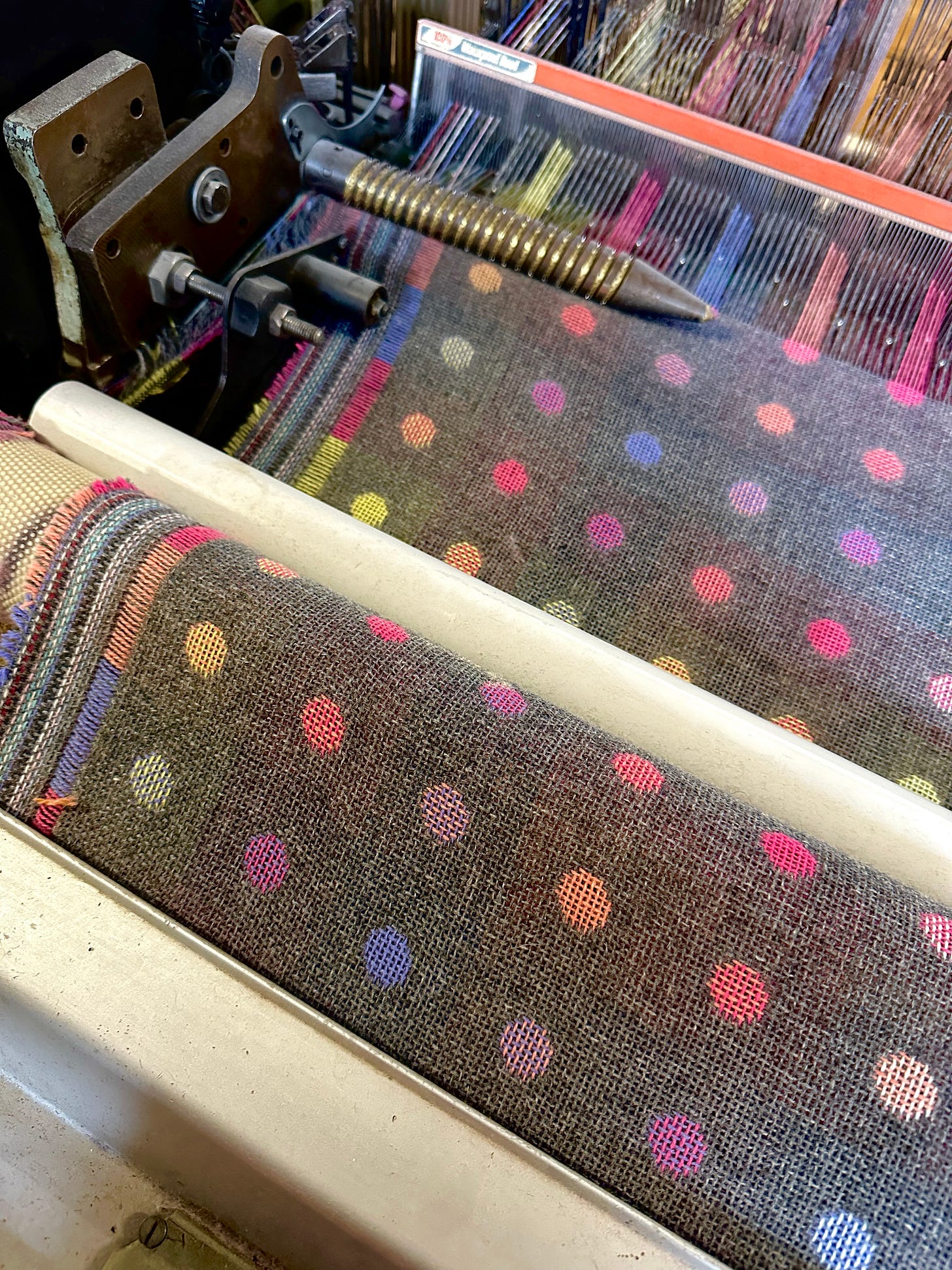 Wool fabric suspended mid-weave at Foxford