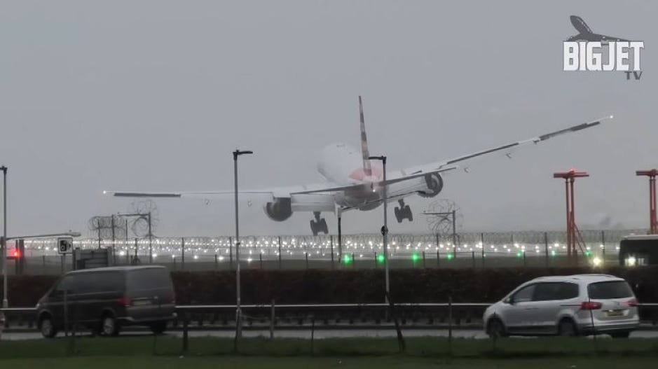 This is a screenshot from a video taken on the 28th of December 2023 at Heathrow Airport. The video, and the screenshot, are taken from outside the landing track, as a plane is approaching to land, and is pushed away by wind, making the plane tilt and bump as it tries to land. This is a screenshot from a video taken on the 28th of December 2023 at Heathrow Airport. The video, and the screenshot, are taken from outside the landing track, as a plane is approaching to land, and is pushed away by wind, making the plane tilt and bump as it tries to land.