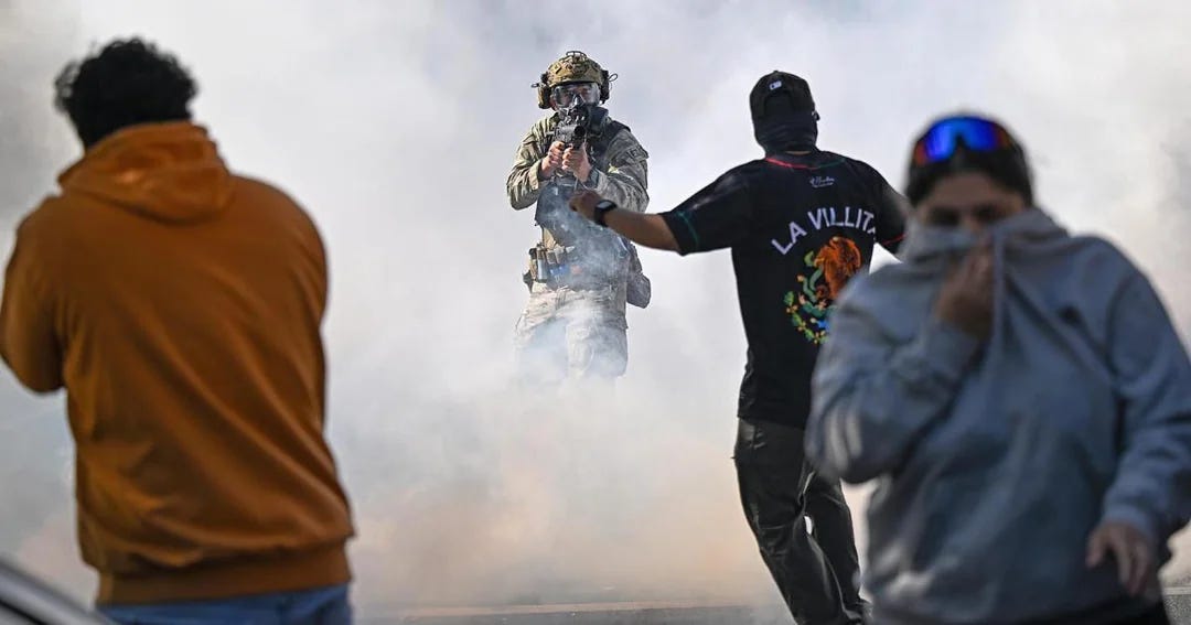 three civilians reaction to immigration enforcer pointing a weapon at the amid a cloud of tear gas in chicago