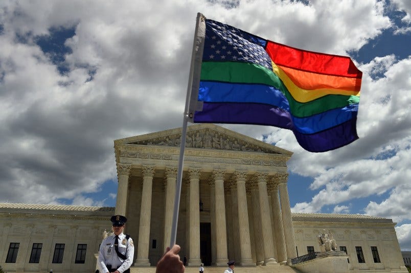 WASHINGTON, DC - APRIL 28: A supporter of gay marriage waves his rainbow flag in front of the U.S. Supreme Court in Washington, D.C., April 28, 2015, where cases are heard about the constitutional right of same sex marriage. (Photo by Astrid Riecken For The Washington Post via Getty Images) WASHINGTON, DC - APRIL 28: A supporter of gay marriage waves his rainbow flag in front of the U.S. Supreme Court in Washington, D.C., April 28, 2015, where cases are heard about the constitutional right of same sex marriage. (Photo by Astrid Riecken For The Washington Post via Getty Images)