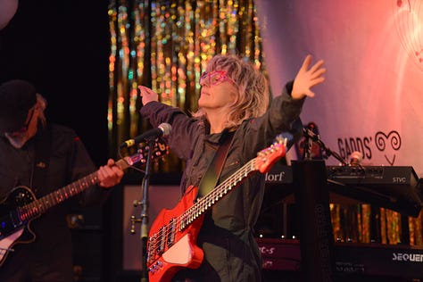 Various images of a music concert with bass, electric guitars and drums and a man and a woman singing