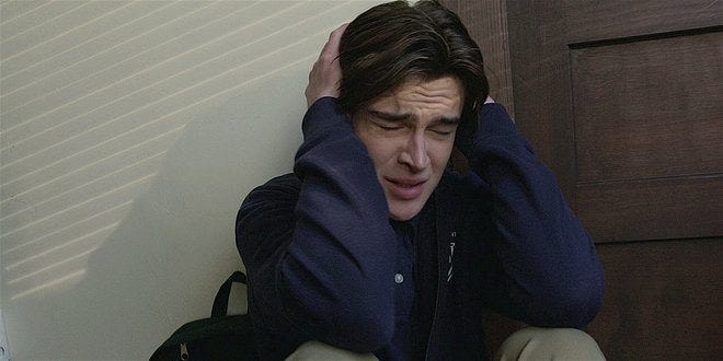 Walker Augie holding hands over ears at school with PTSD episode. Walker Augie holding hands over ears at school with PTSD episode.