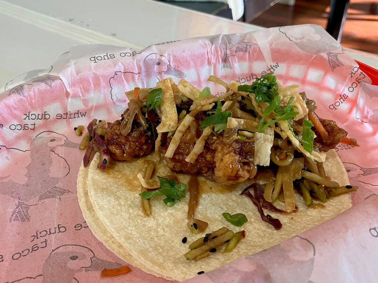 May be an image of gyro, burrito and taco
