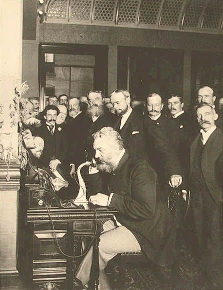 Bell placing the first telephone call from NYC to Chicago