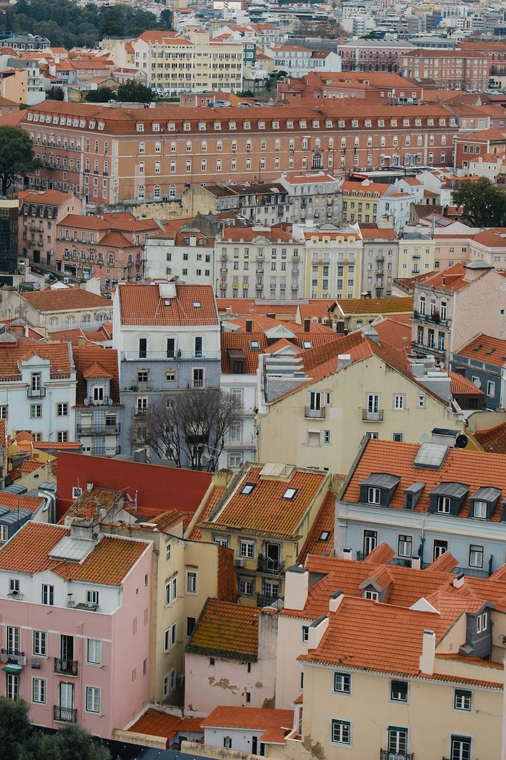 Views over Lisbon rooftops, 25 April bridge and castle do Sao Jorge.