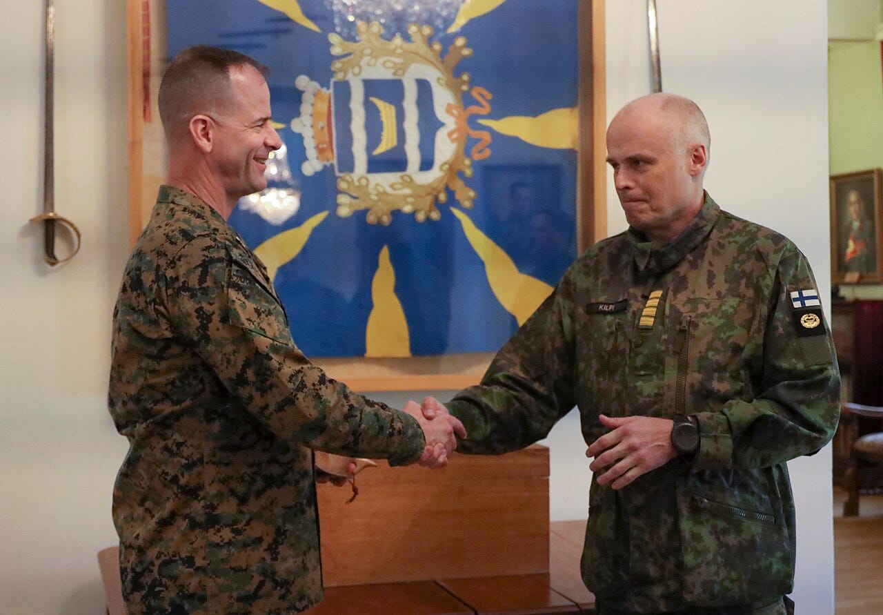RASEBORG, Finland (May 18, 2022) - Col. Robert Hallett (left), deputy commander of Task Force 61/2, and Capt. Juha Kilpi, commanding officer of Nyland brigade, shake hands after discussing future integration opportunities between the Finnish Uusimaa 