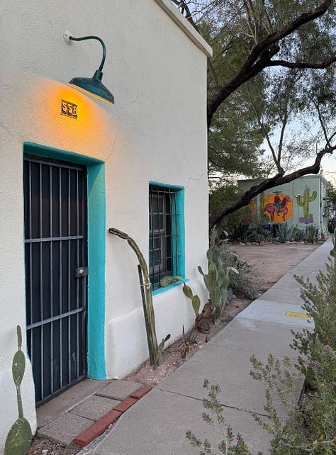 The photos display nine homes in the Sonoran architectural style traditional to the Southwest of the United States. The homes feature flat roofs, front walls that begin at the sidewalk's edge, colorful stucco exterior walls, and large windows.
