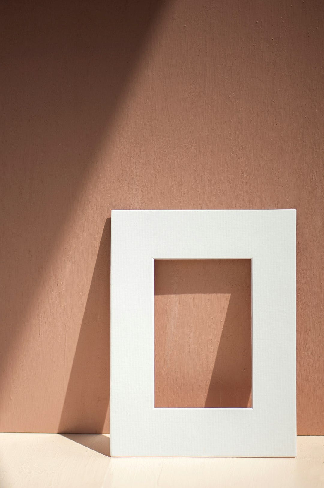 white wooden frame on orange wall white wooden frame on orange wall