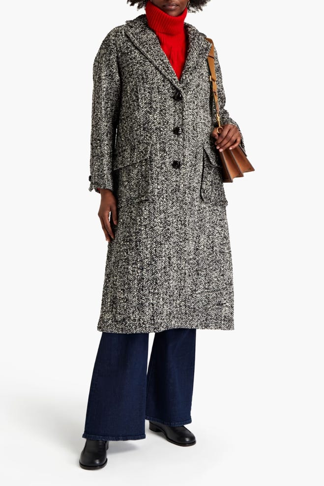 A person in a long coat

AI-generated content may be incorrect.