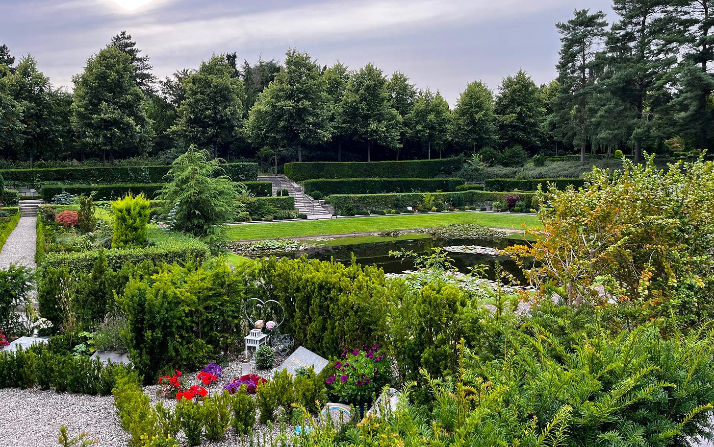 tiered gardens with grave around the ornamental pool