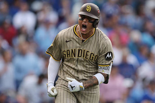 Manny Machado of the San Diego Padres celebrates a two-run home run off Shota Imanaga of the Chicago Cubs during the fifth inning at Wrigley Field on...