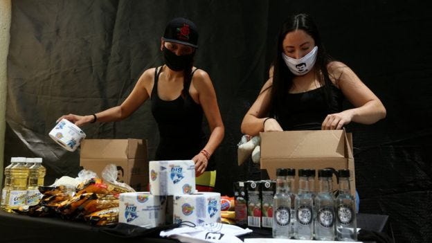 Employees of the clothing brand owned by El Chapo's daughter box up food supplies Employees of the clothing brand owned by El Chapo's daughter box up food supplies