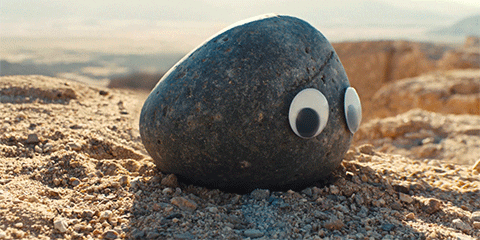 Movie gif. A scene from Everything Everywhere All At Once. One of the rocks with big googly eyes turns to face us. Even though the rock cannot emote, it does look like it’s surprised and confused. Movie gif. A scene from Everything Everywhere All At Once. One of the rocks with big googly eyes turns to face us. Even though the rock cannot emote, it does look like it’s surprised and confused.