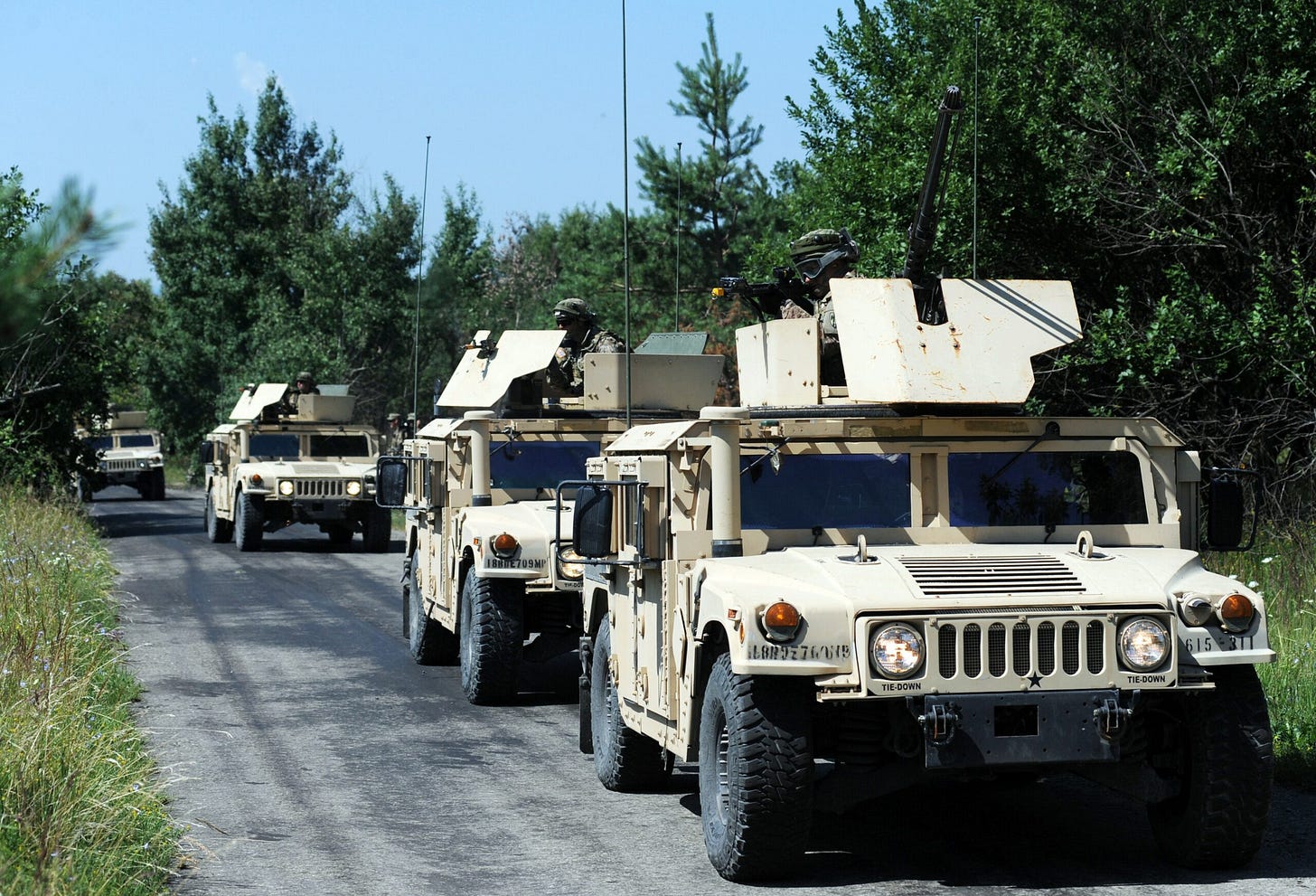 U.S. servicemen stand on humvees as they take part in a military drill in western Ukraine on July 22, 2015. Credit: Yuriy Dyachyshyn/AFP via Getty Images