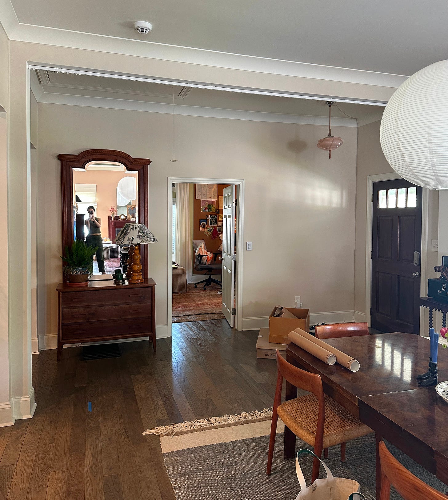 Vintage eclectic entryway design with console table and mirror