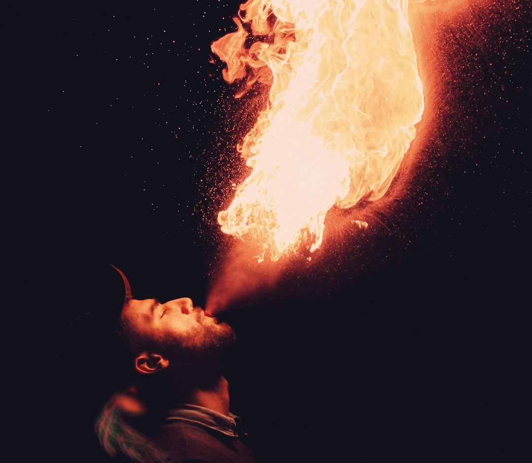 man blowing fire man blowing fire