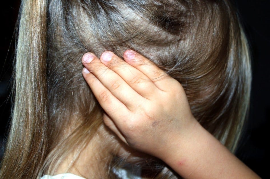 Frightened white child