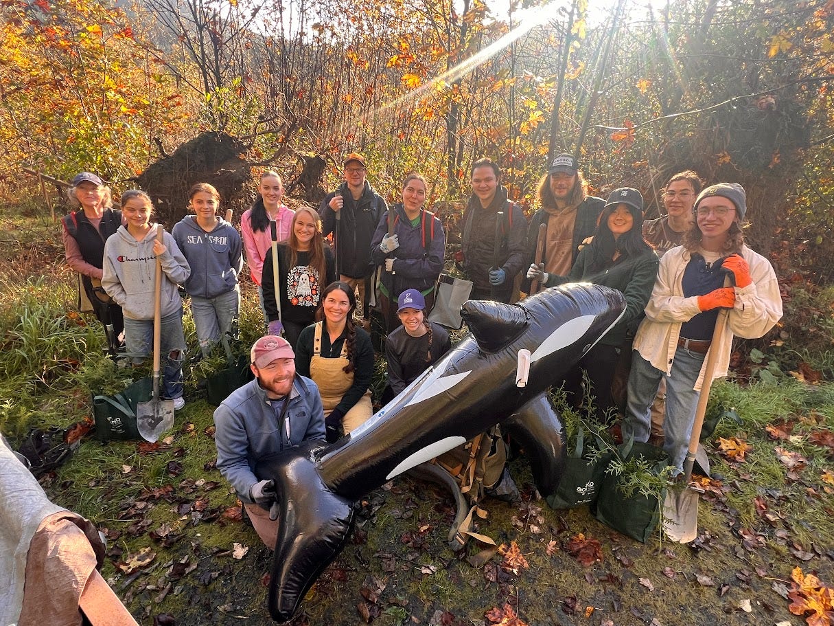 May be an image of 12 people and orca May be an image of 12 people and orca