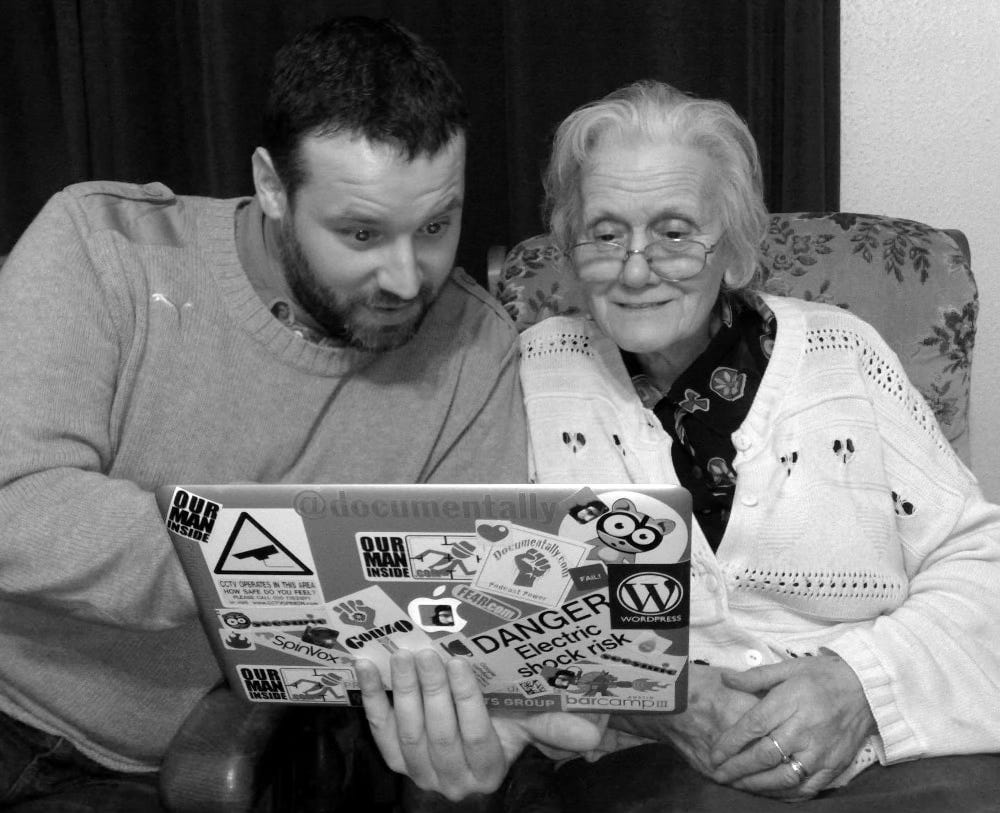 me and my gran looking at the screen of a MacBook Air 