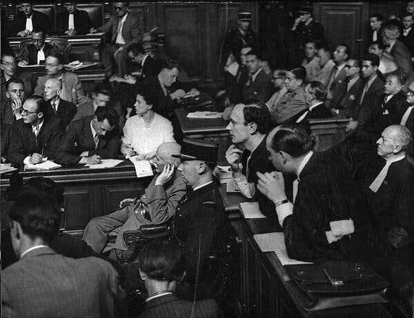 A black-and-white photograph at the 1945 trial of Marshal Henri-Philippe Pétain.